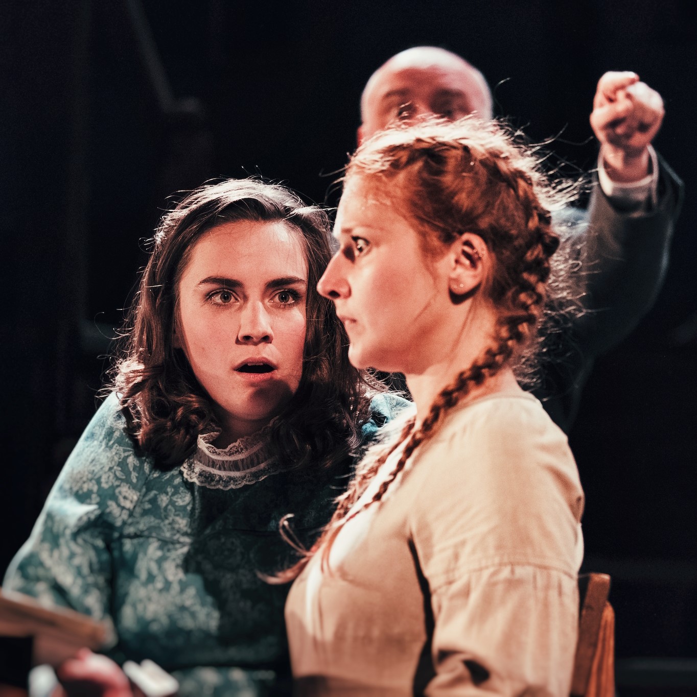 Two girls with surprised expressions on their faces